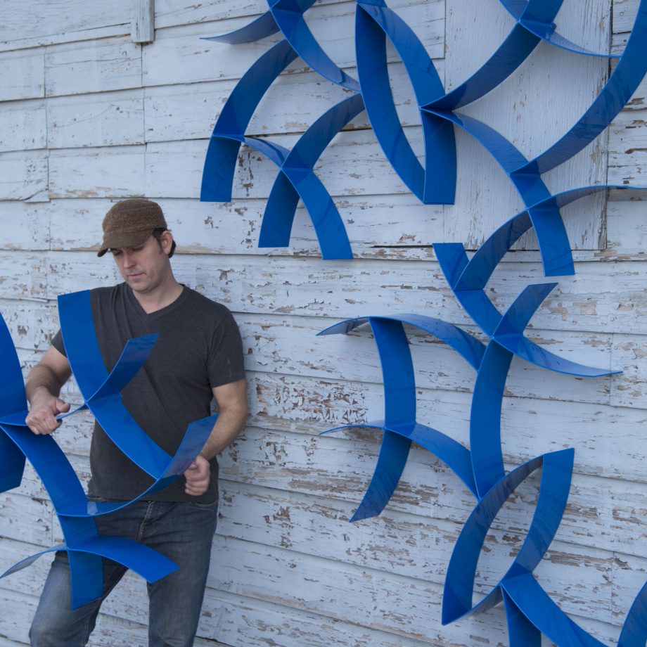 Blue wall hanging sculptures by Morgan Robinson